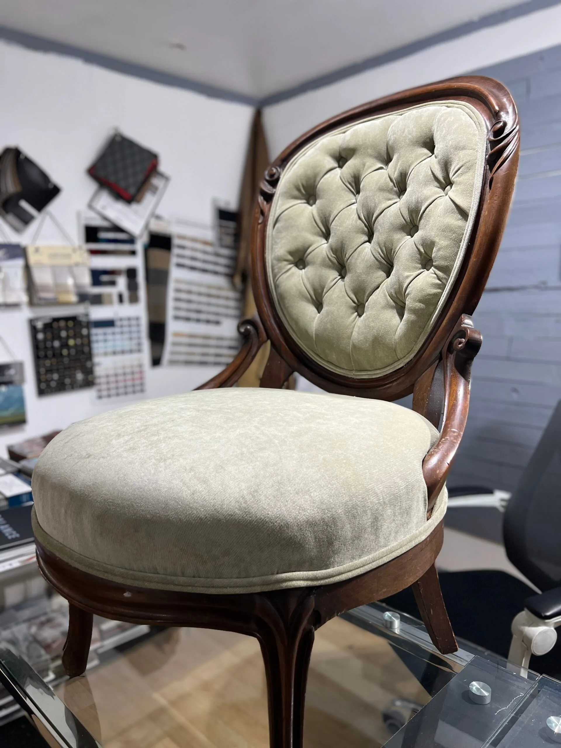 Victorian parlor chair with cream button-tufted velvet upholstery