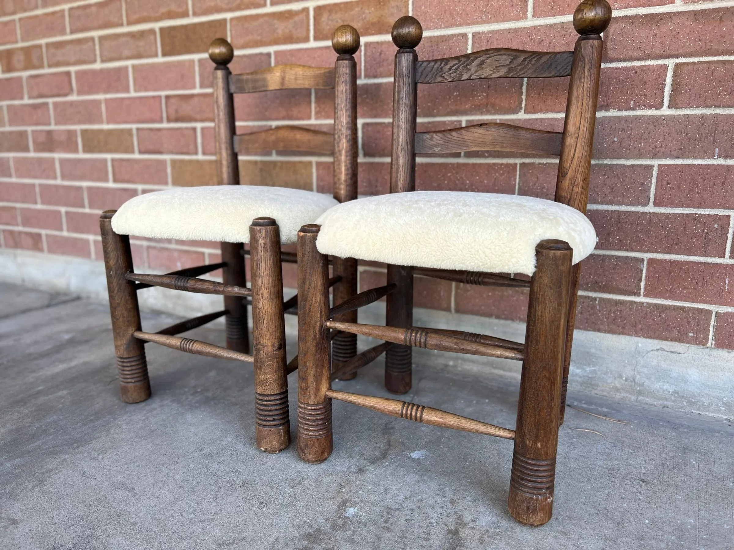 Rustic ladder-back chairs with fresh cream bouclé seats